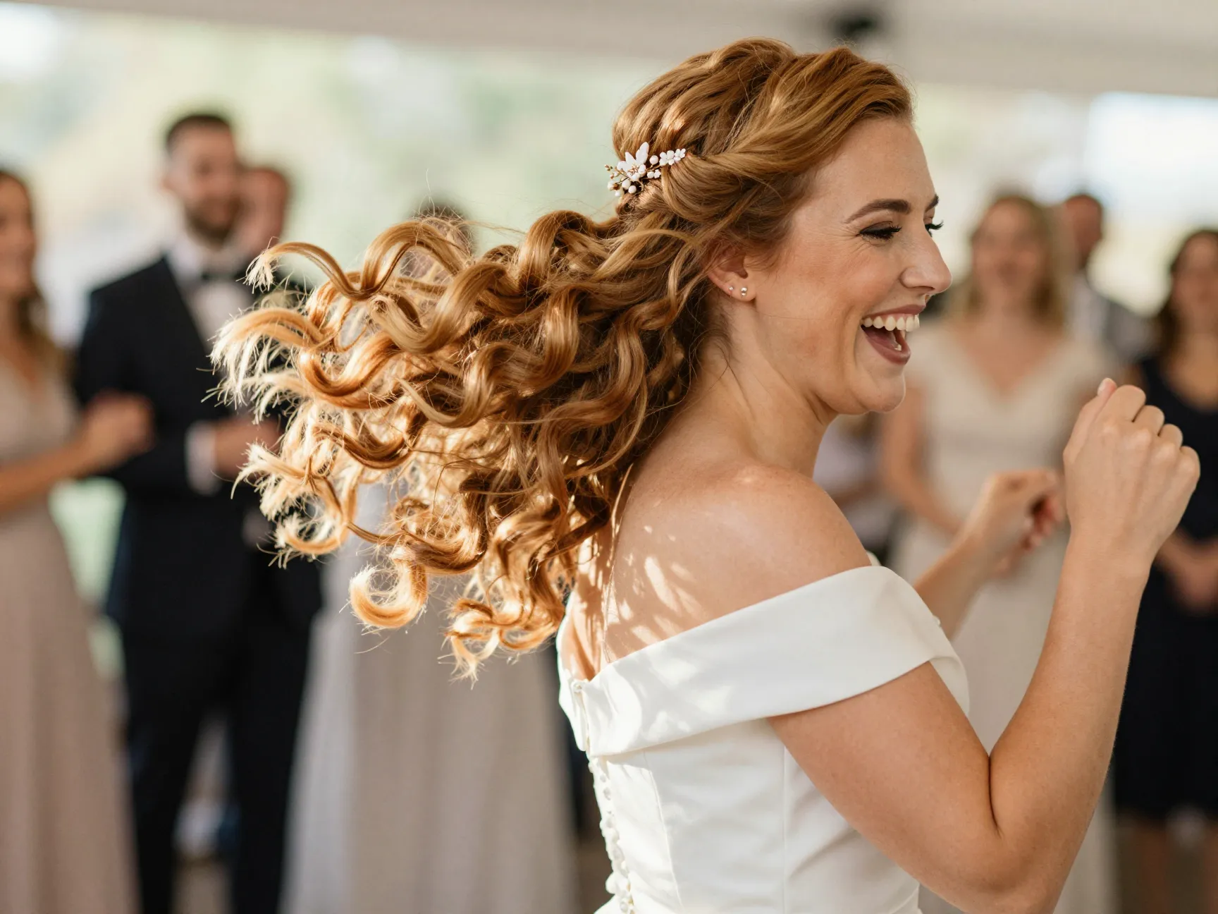 Classic bouncy curls on bride with floral hairpin detail