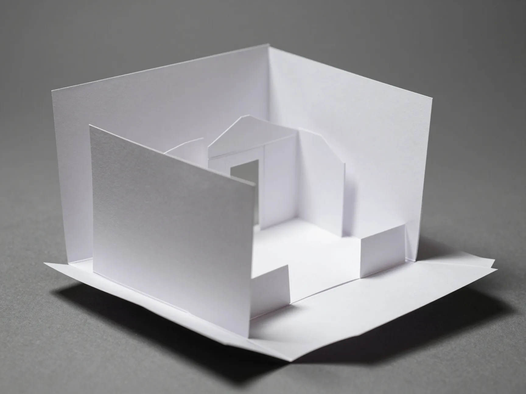 Opened 3d pop up details card revealing a miniature paper venue sculpture