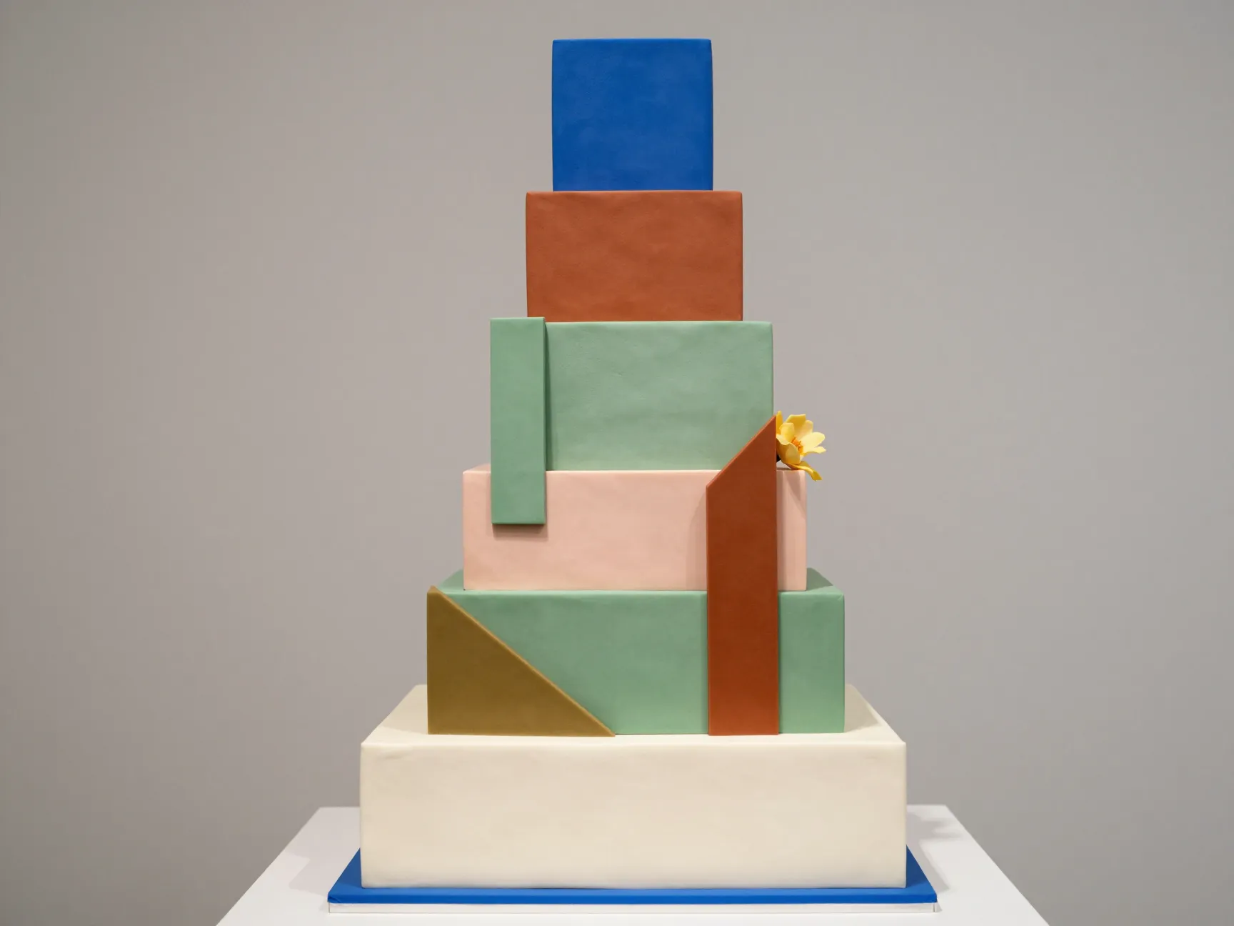 Bold color blocked wedding cake with geometric tier panels