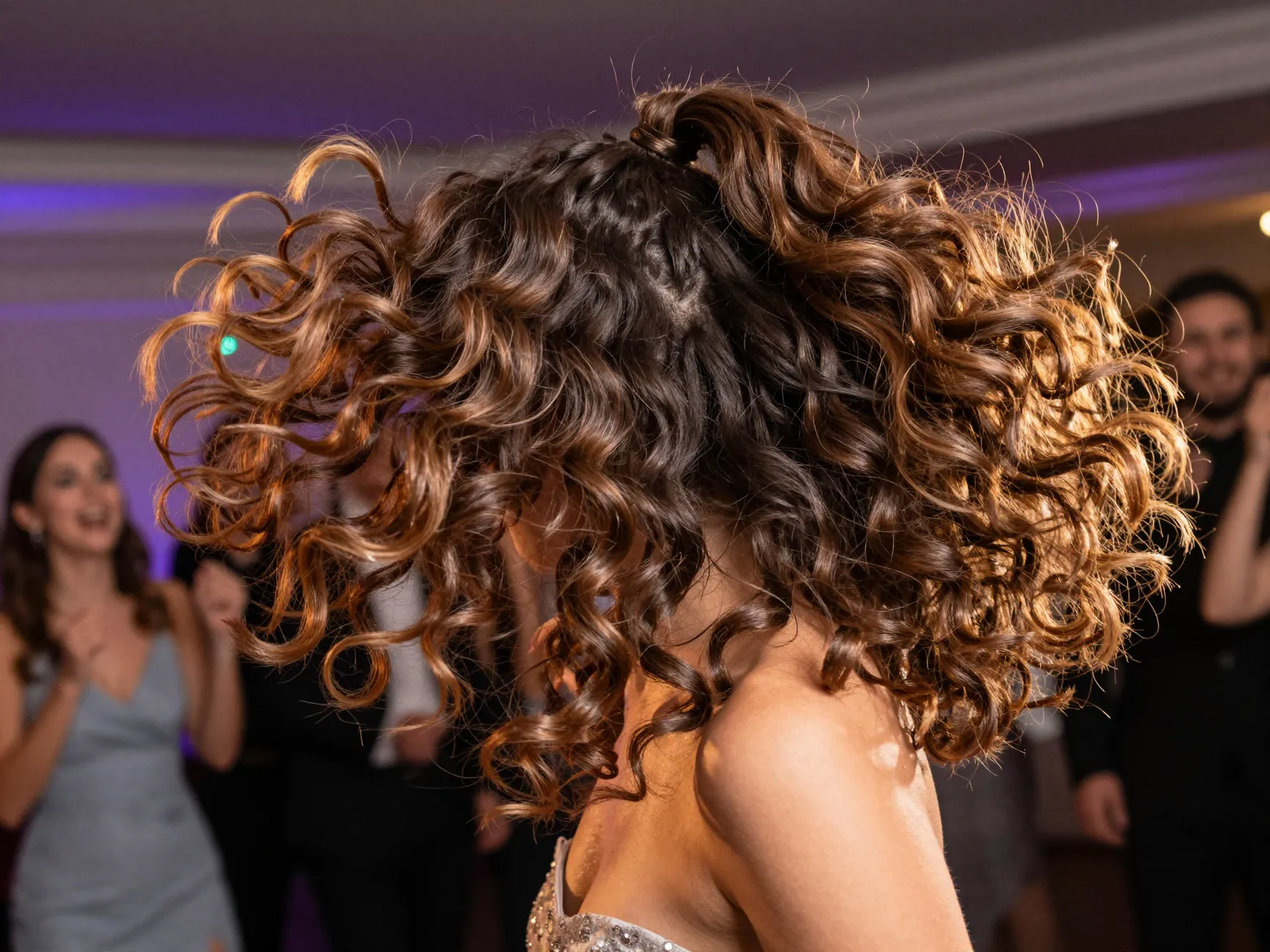 Voluminous high party ponytail with bouncy defined curls