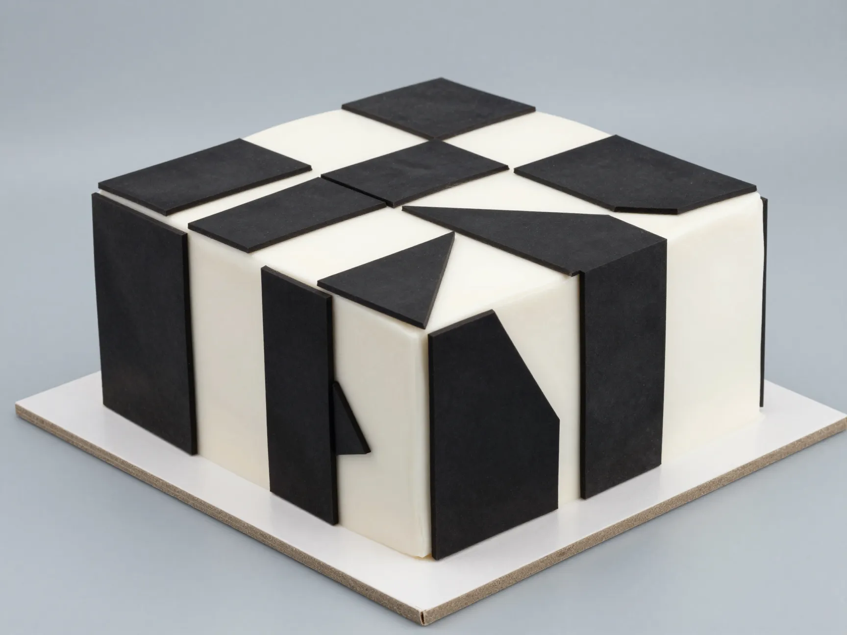 Geometric panelled square cake with contrasting fondant and mirror glaze