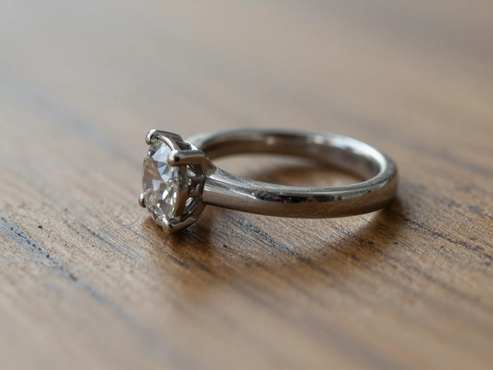 Engagement ring on a chunky band photographed from a low side angle
