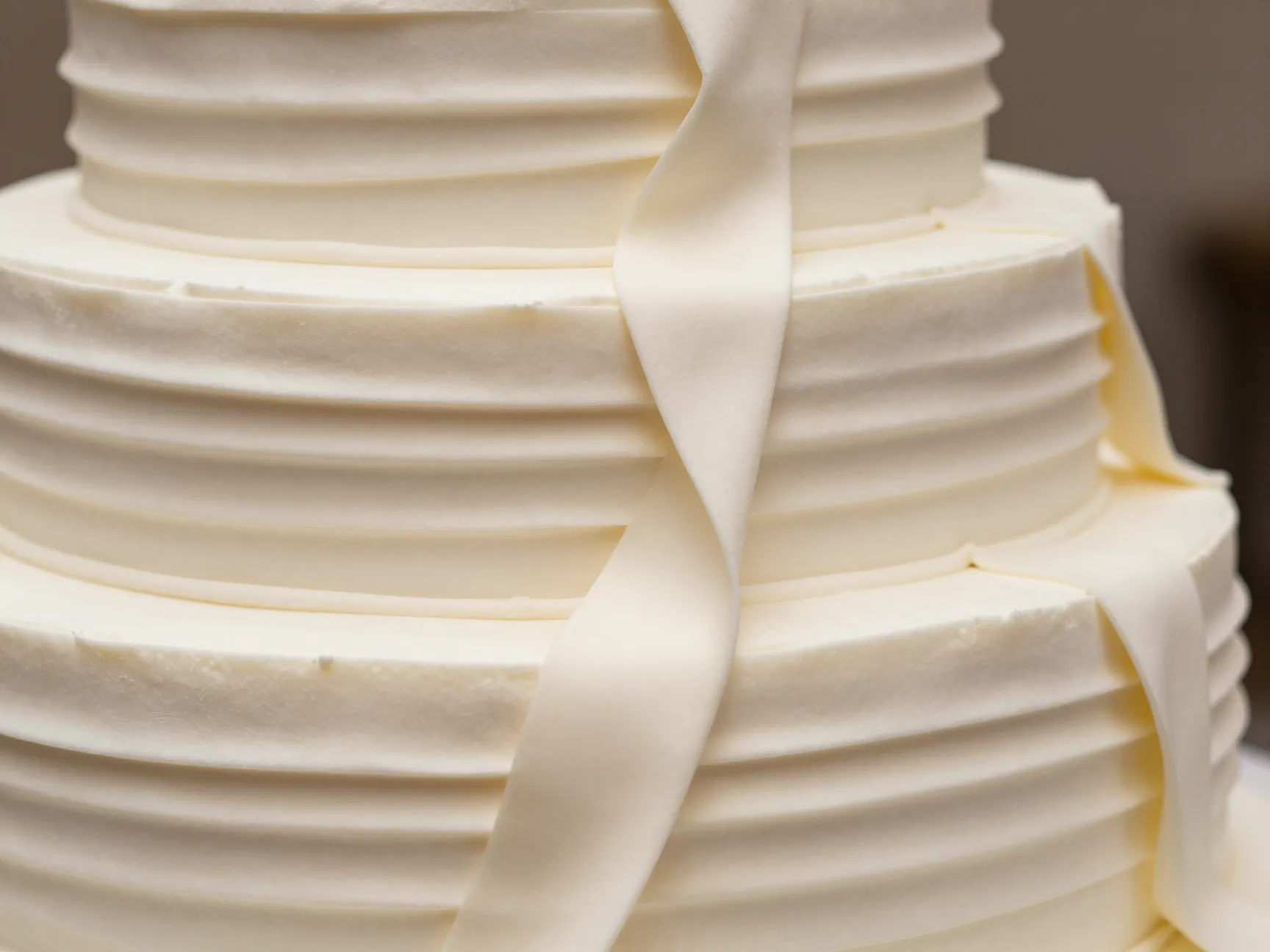 Textile inspired wedding cake with pleated buttercream and tonal palette