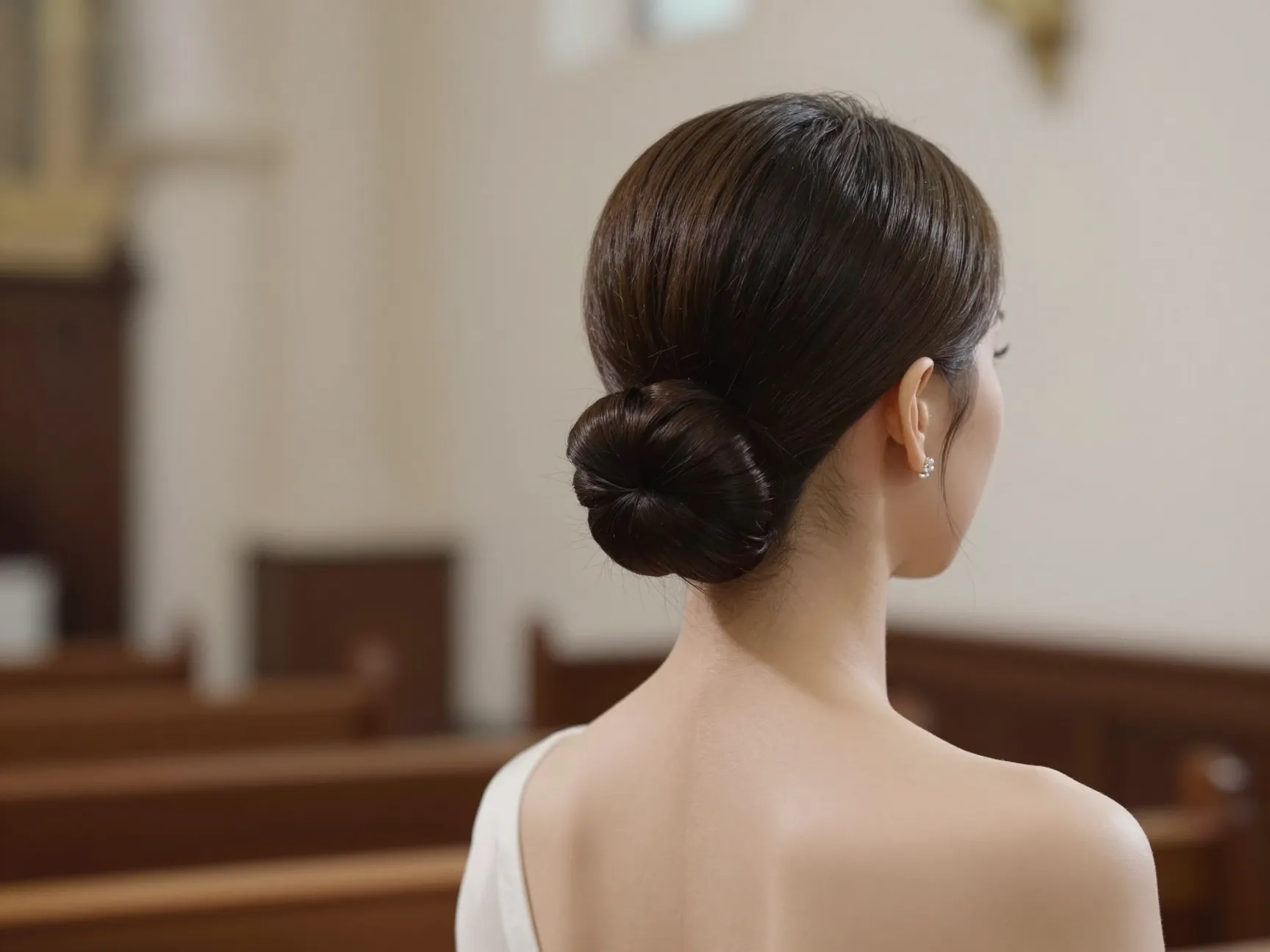 Classic bridal bun wedding hairstyle timeless refined formal ceremony