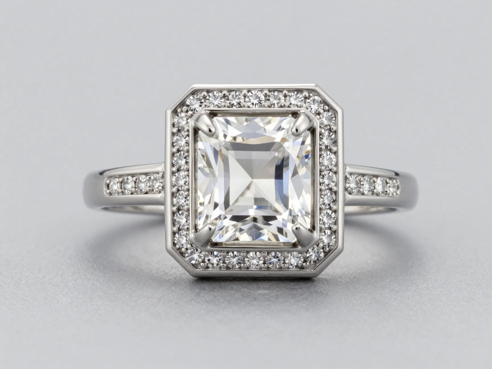Geometric art deco halo ring with square center stone