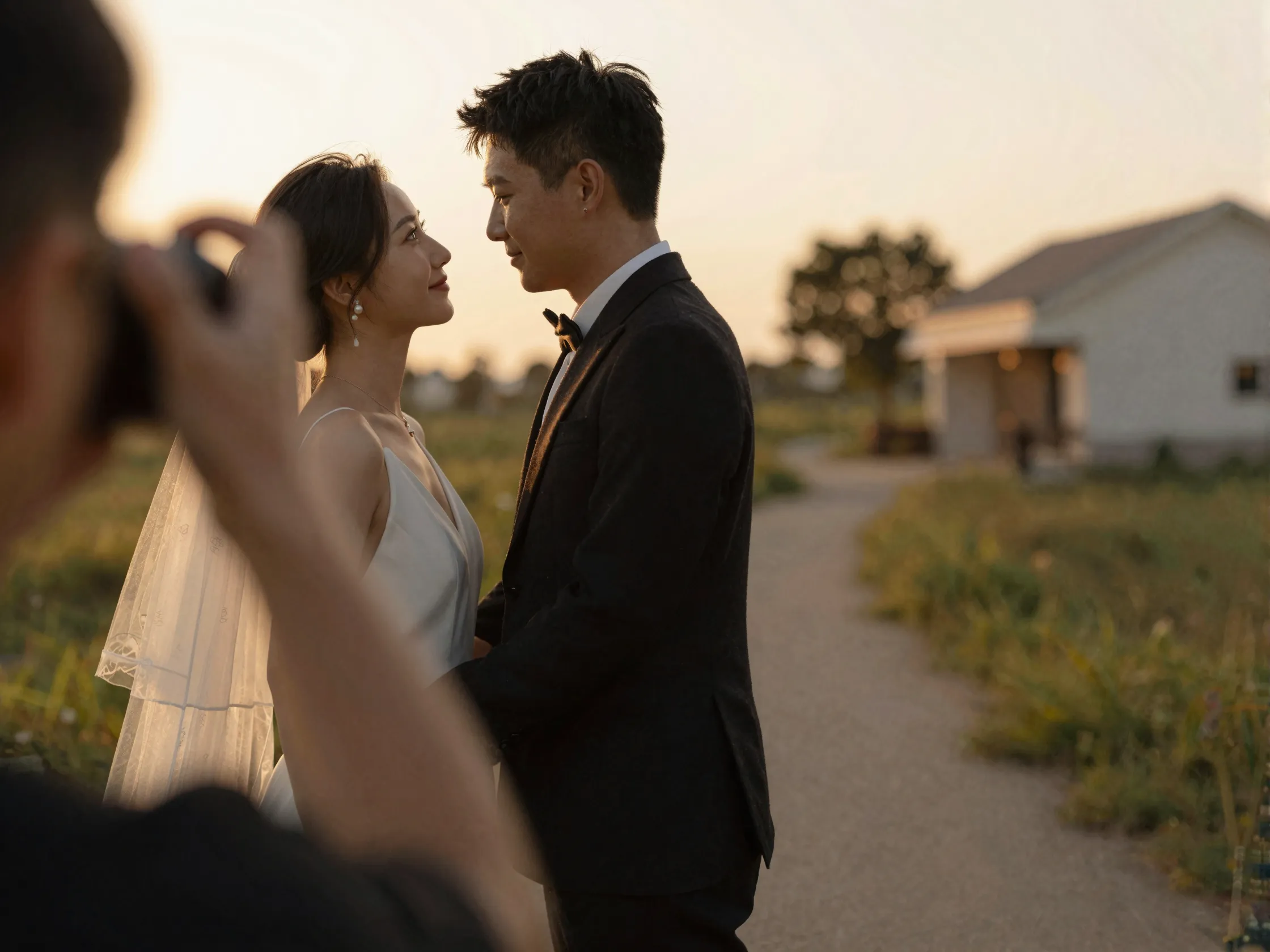 Couple portrait session in golden hour light with photographer directing