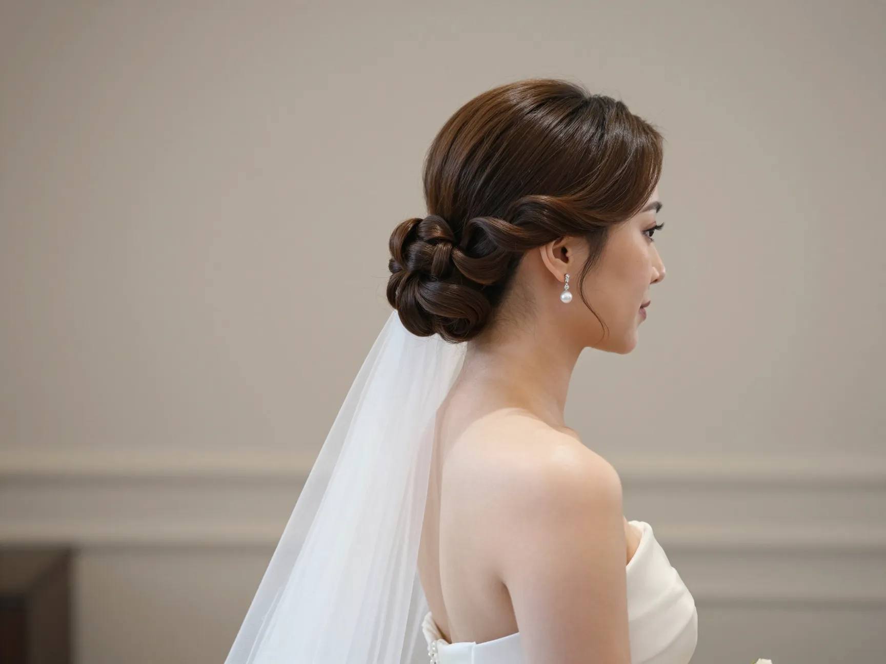 Bride with architectural chignon and polished tendrils wedding aisle