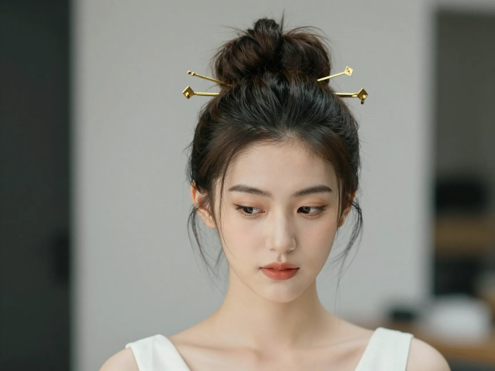 Bride with 90s nostalgic high updo and sculptural pins