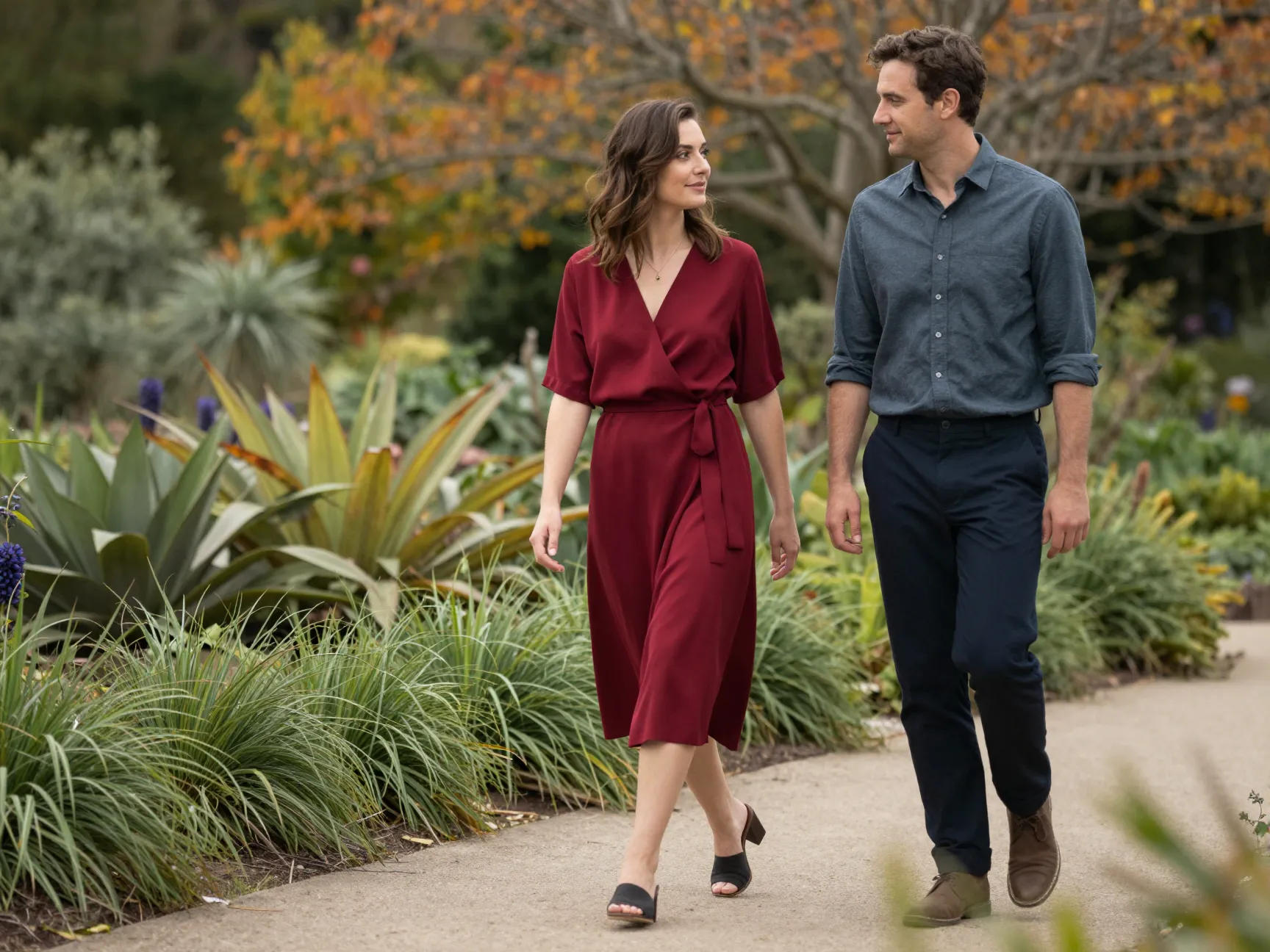 Red wrap dress in botanical garden with partner dark chinos