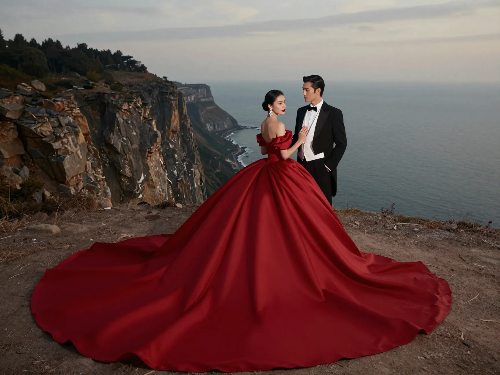 Dramatic red ball gown at cliffside overlook editorial fairy tale