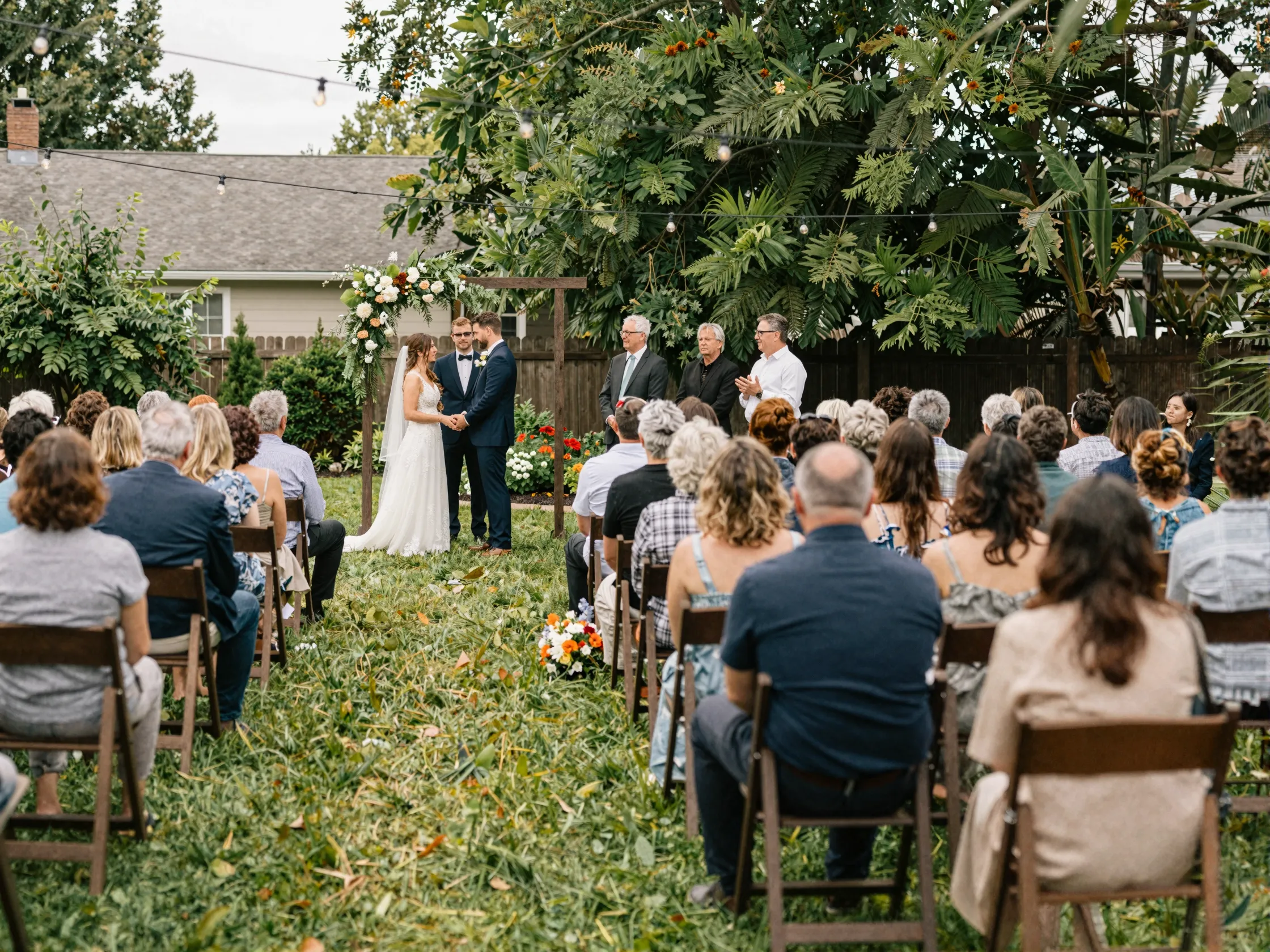 Intimate backyard wedding ceremony with small guest gathering