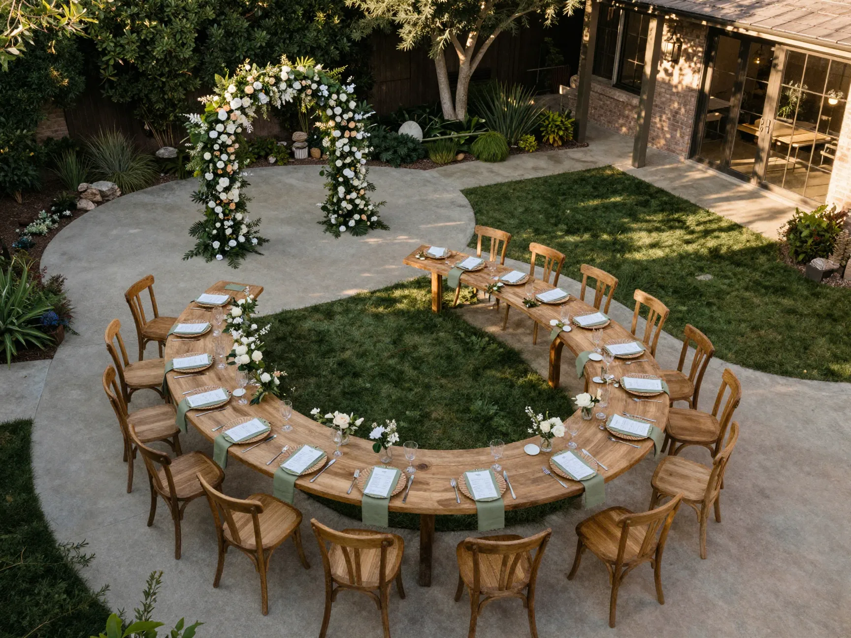 Curved seating layout with serpentine table in backyard garden