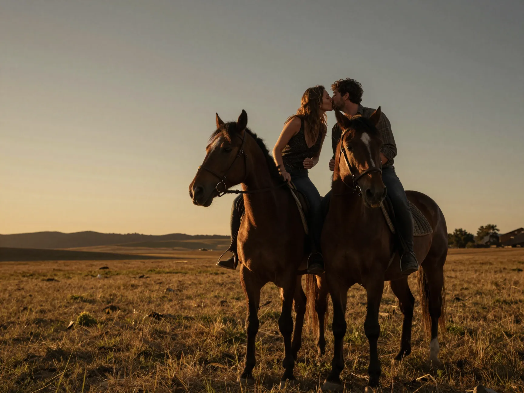 Romantic horseback couple kiss golden hour open field
