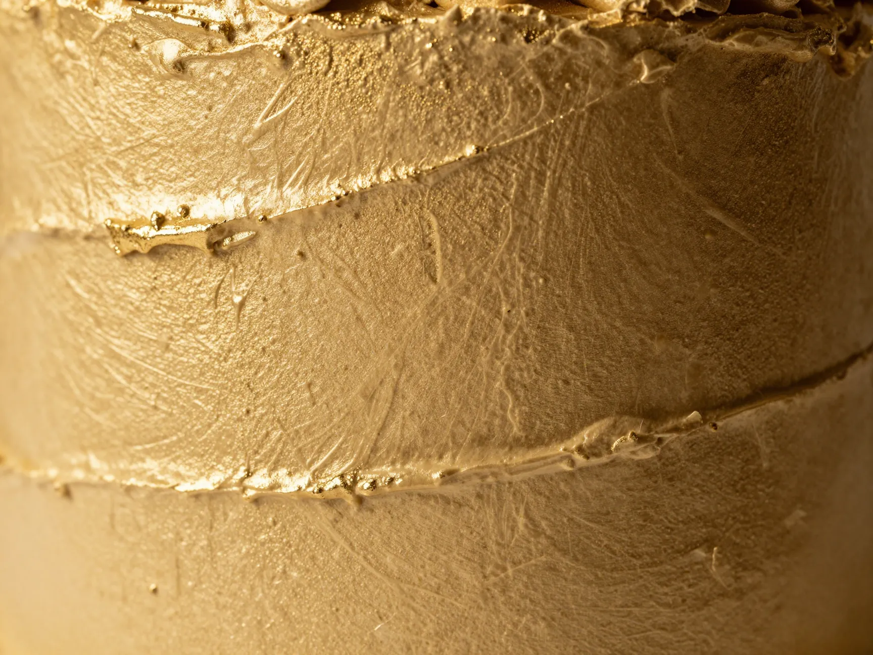 Brushed metallic gold textured buttercream cake surface