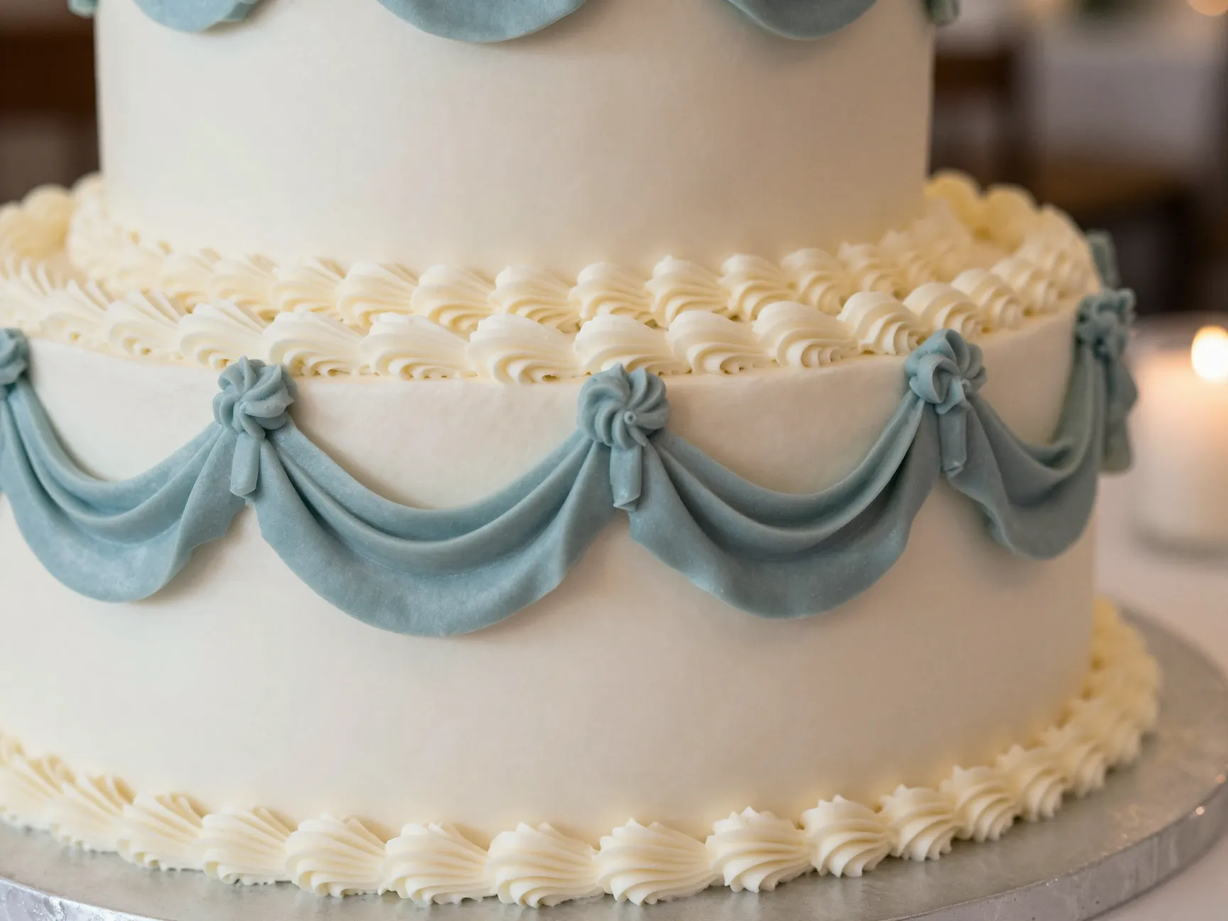 Vintage buttercream swag dusty blue icing with white wilton piping