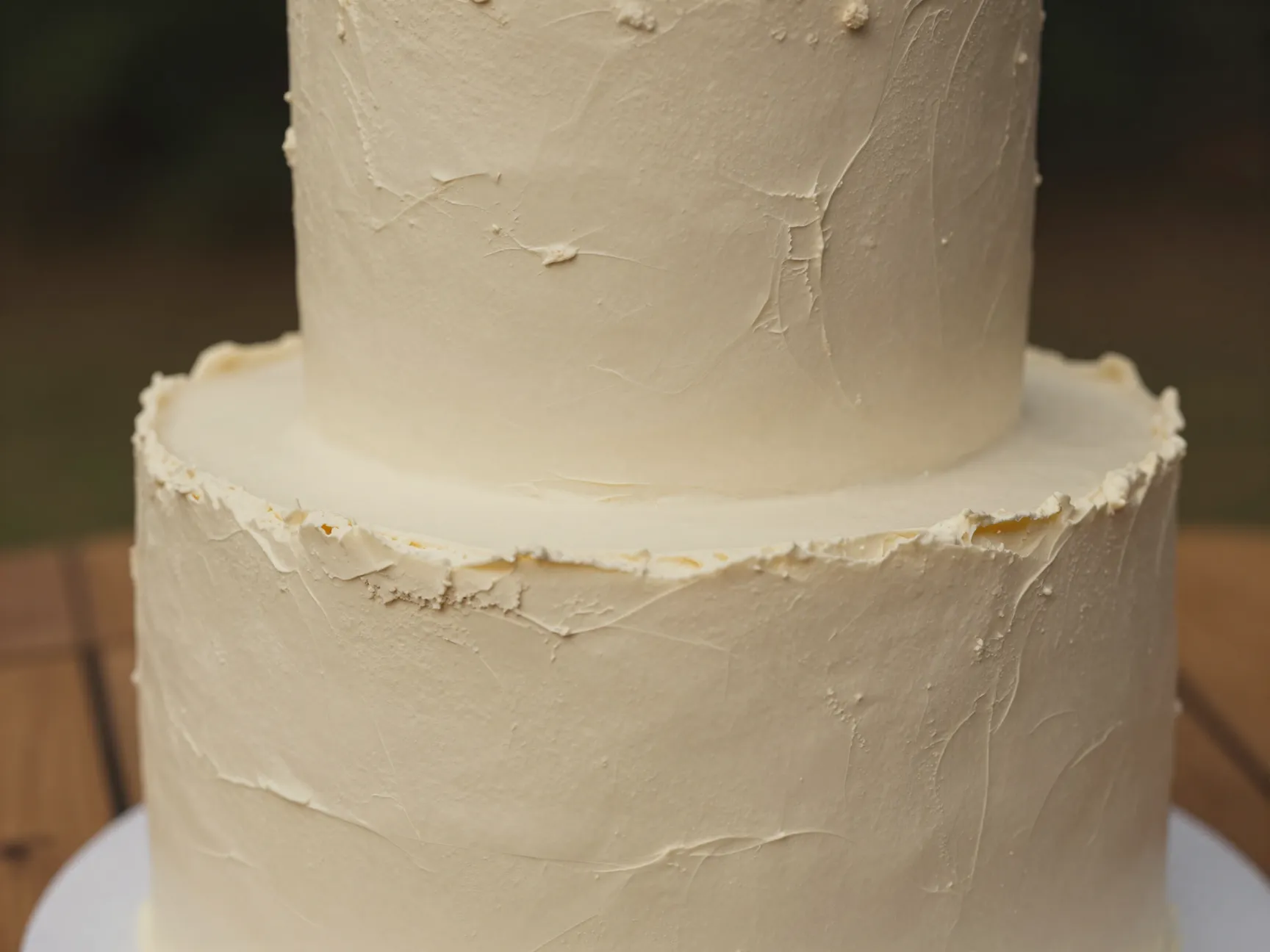 Textured stucco finish buttercream monochromatic ivory cake