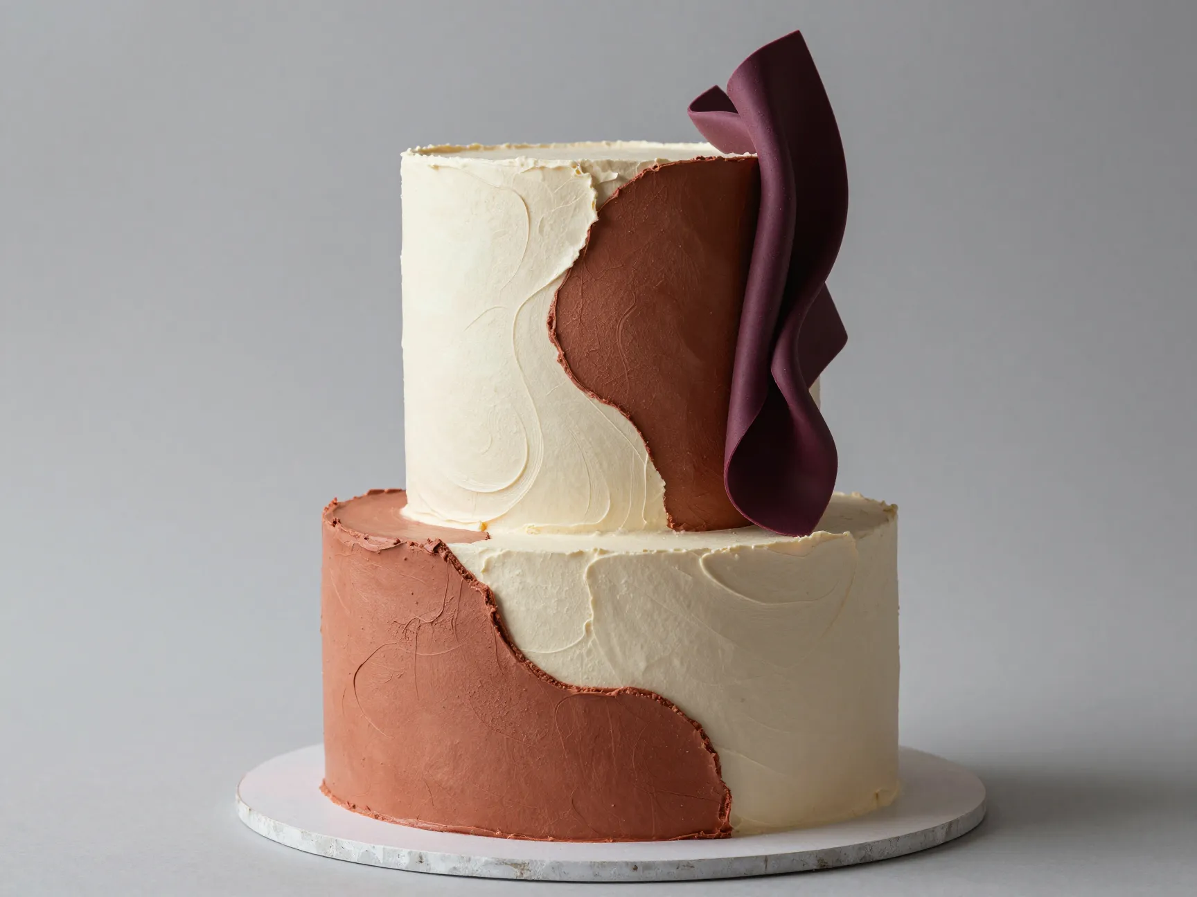 Sculptural asymmetrical single tier cake with organic curves and textured surface