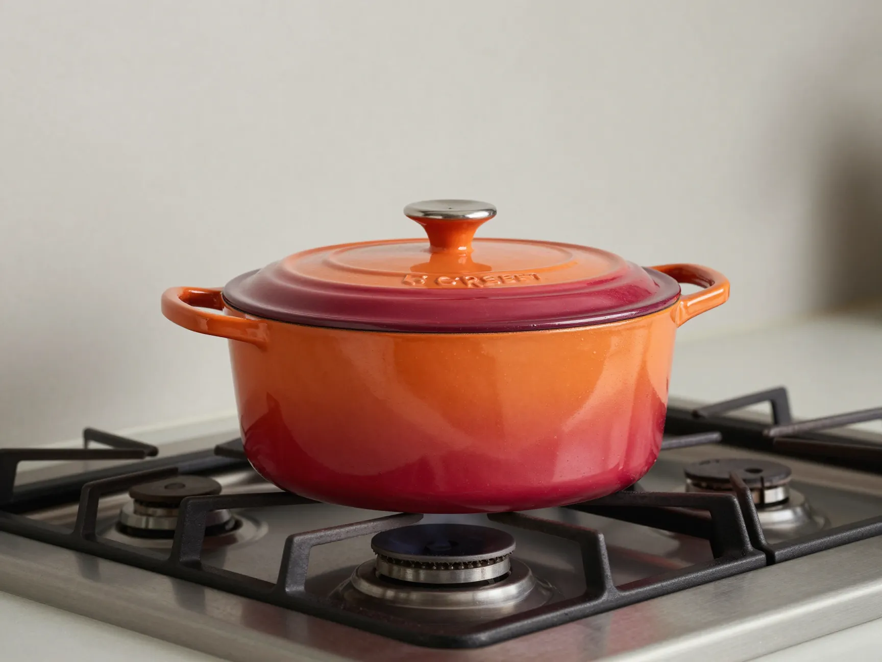 Colorful le creuset dutch oven on a stovetop