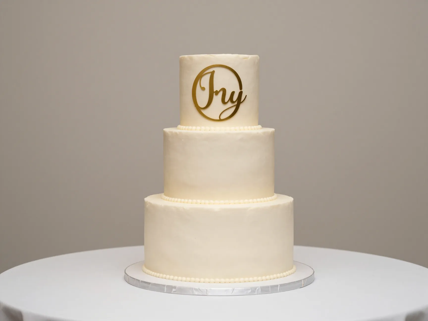 Minimalist monogram cake formal understated elegance cake