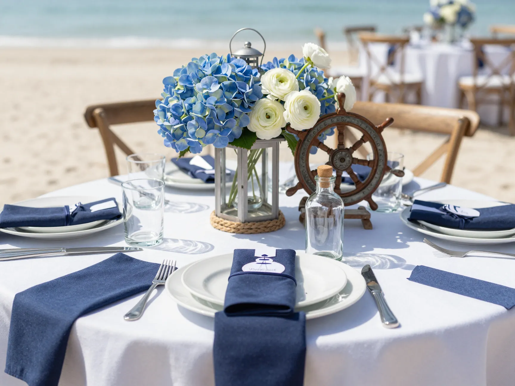 Nautical themed coastal wedding reception decor with navy and white