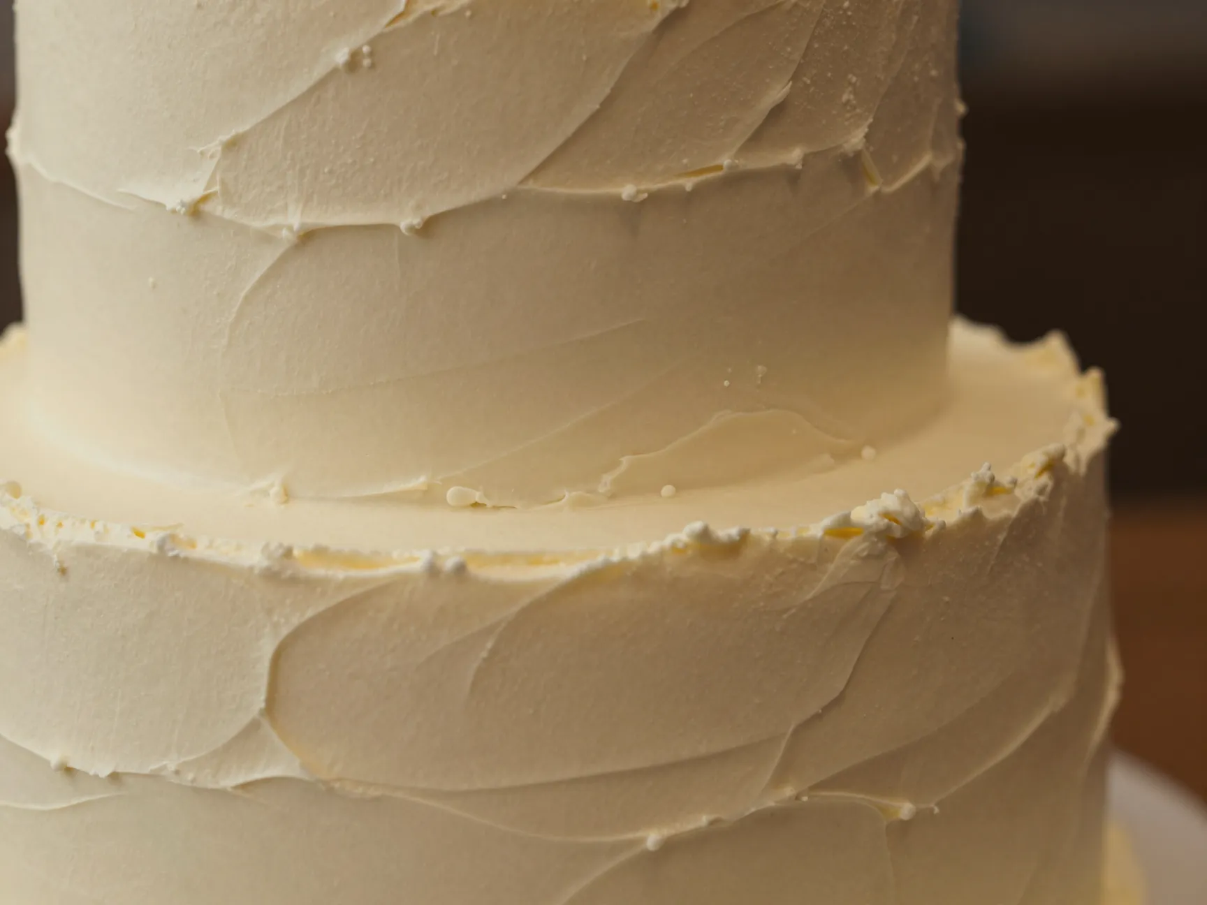 Textured hand applied buttercream wedding cake with palette knife swirls