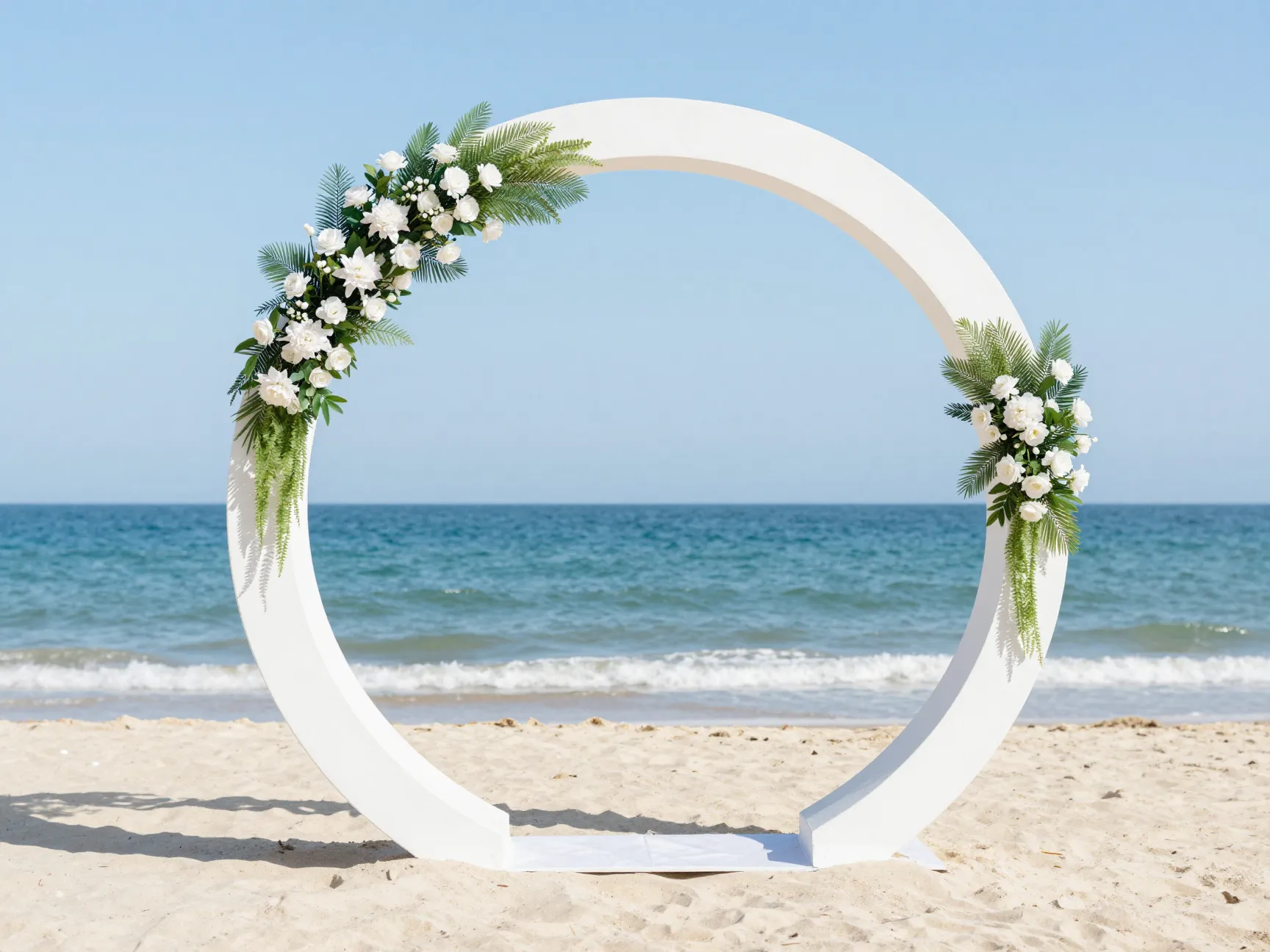 Circular moon gate arch ceremony on beach with ocean horizon