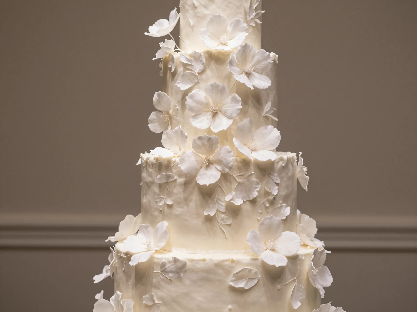 Cascading sugar flowers wafer paper botanicals on tiered cake