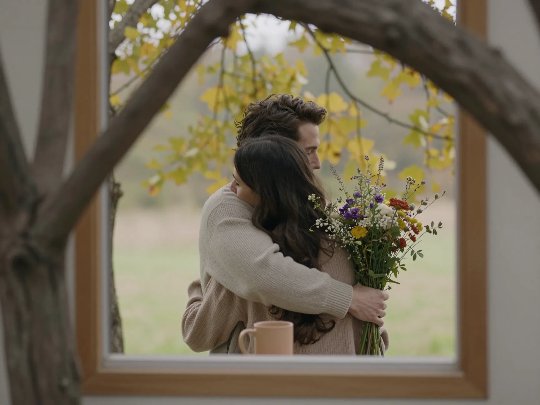 Embrace from behind cozy couple natural frame tree window layered hug