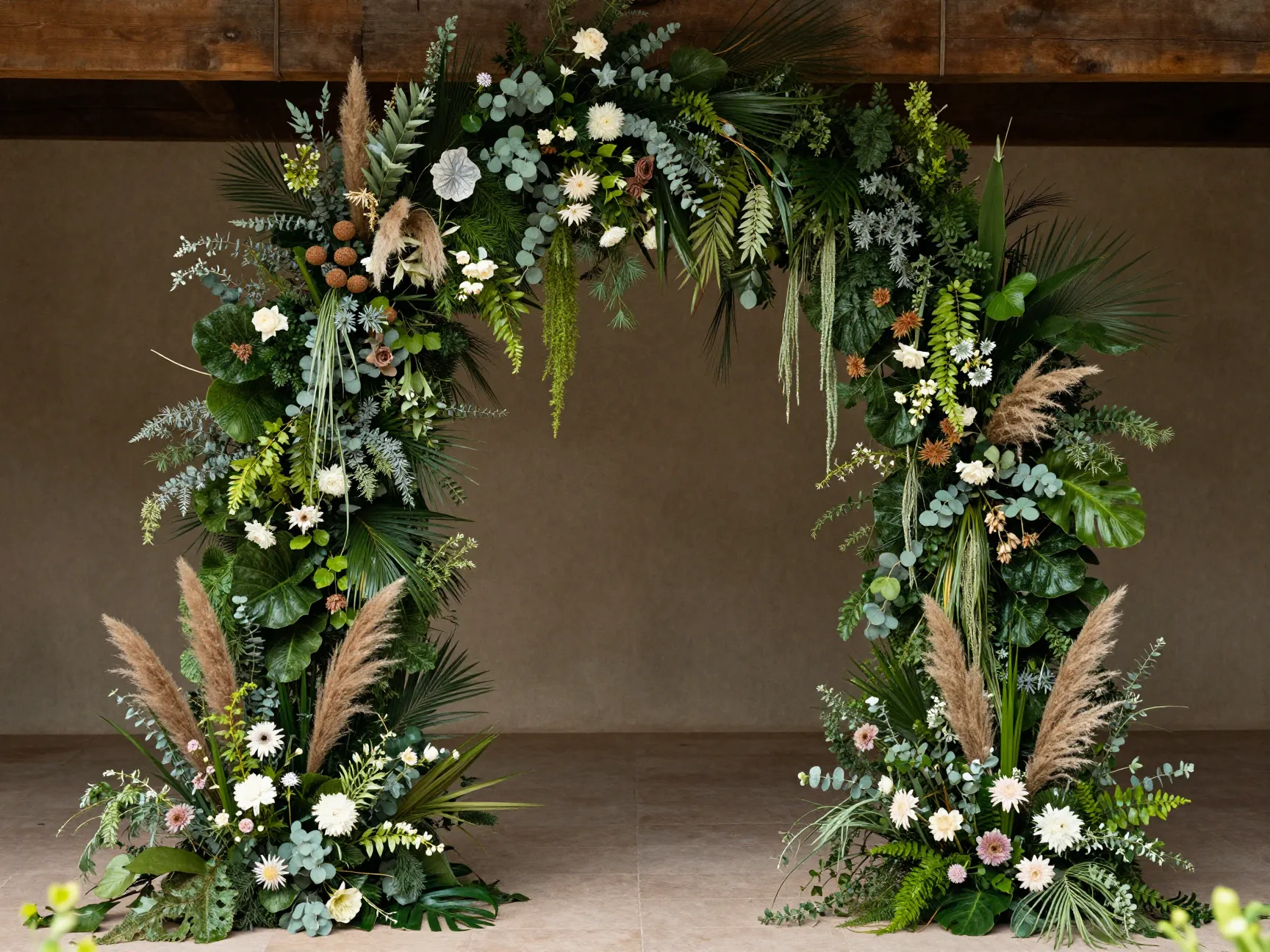 Wild lush asymmetrical cascading greenery floral arch