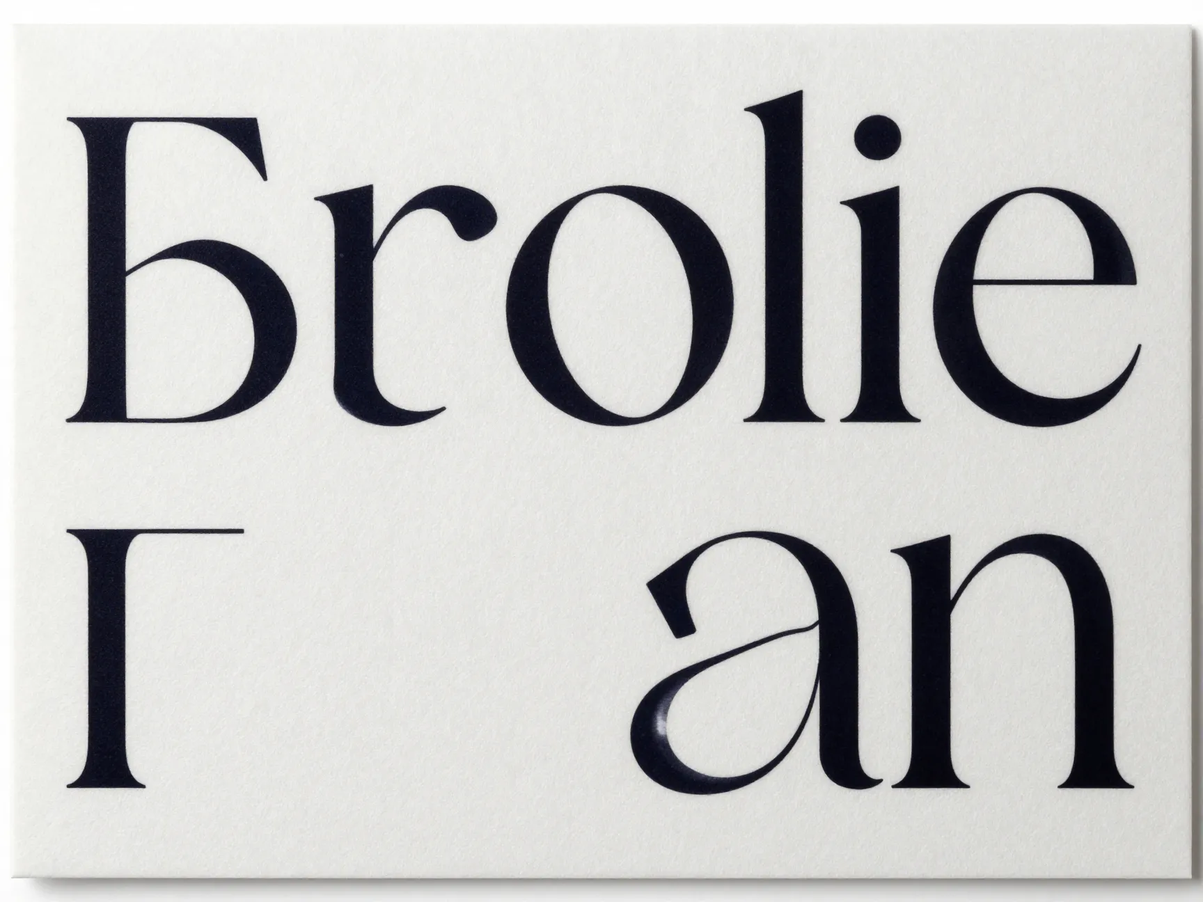 Minimalist oversized serif typography on monochromatic heavy paper