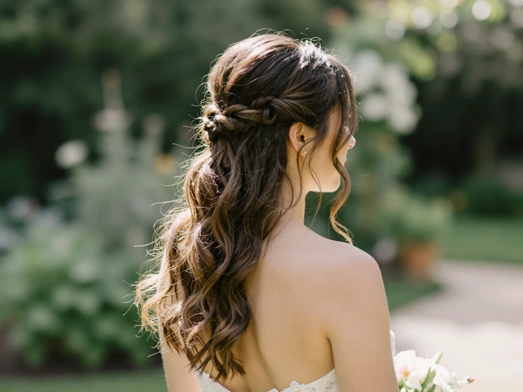 Bride with modern half up style for an outdoor garden ceremony