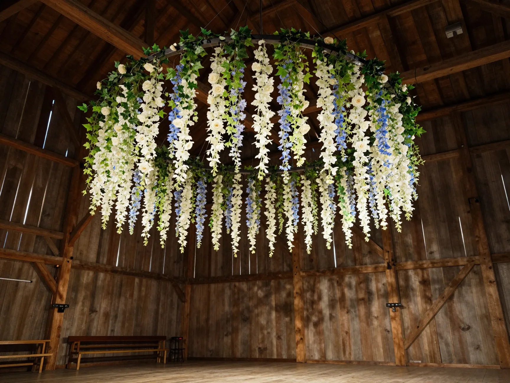 Hanging floral chandelier cascading above barn dance floor