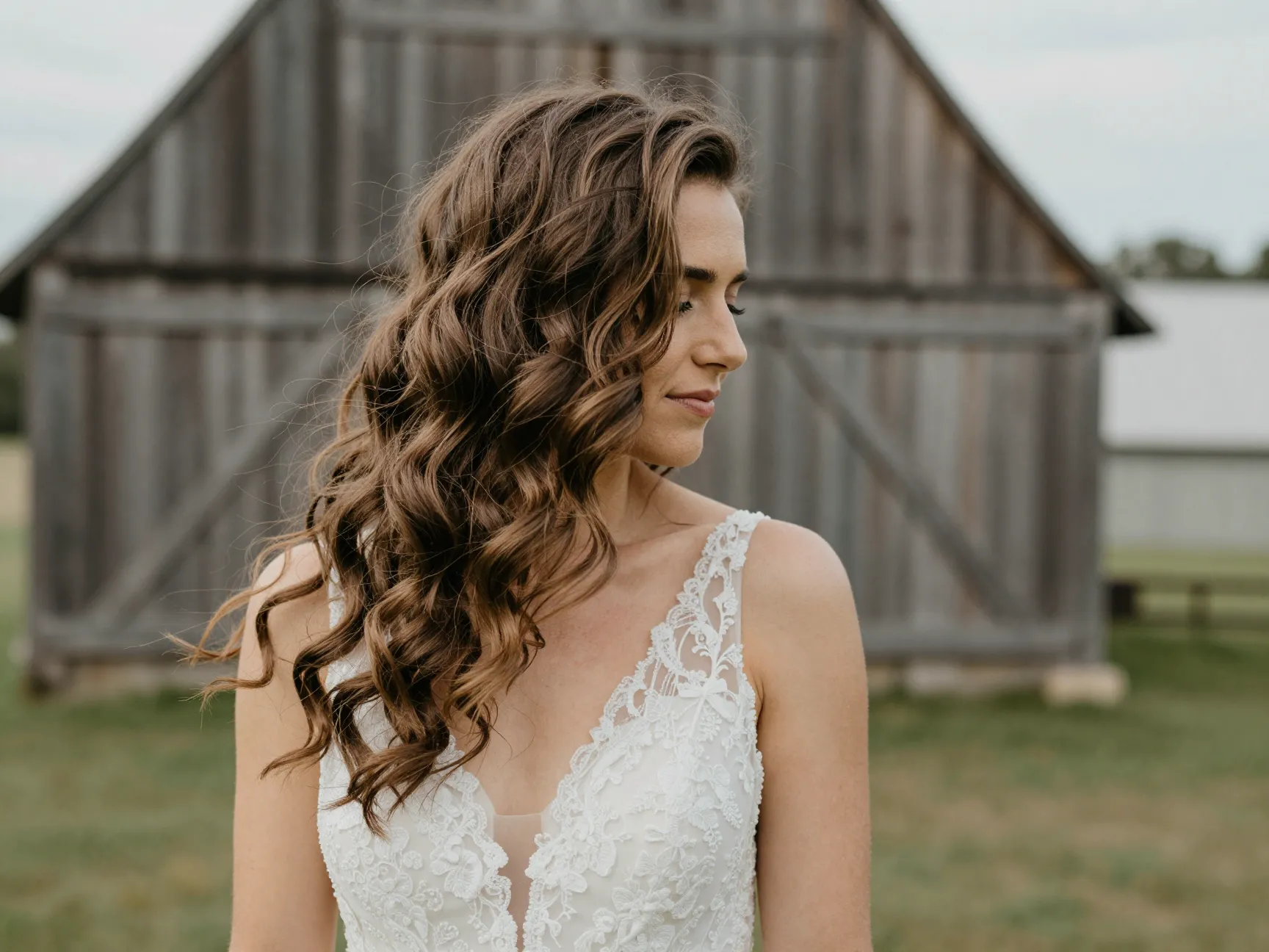 Bride with romantic waves at a rustic outdoor barn wedding