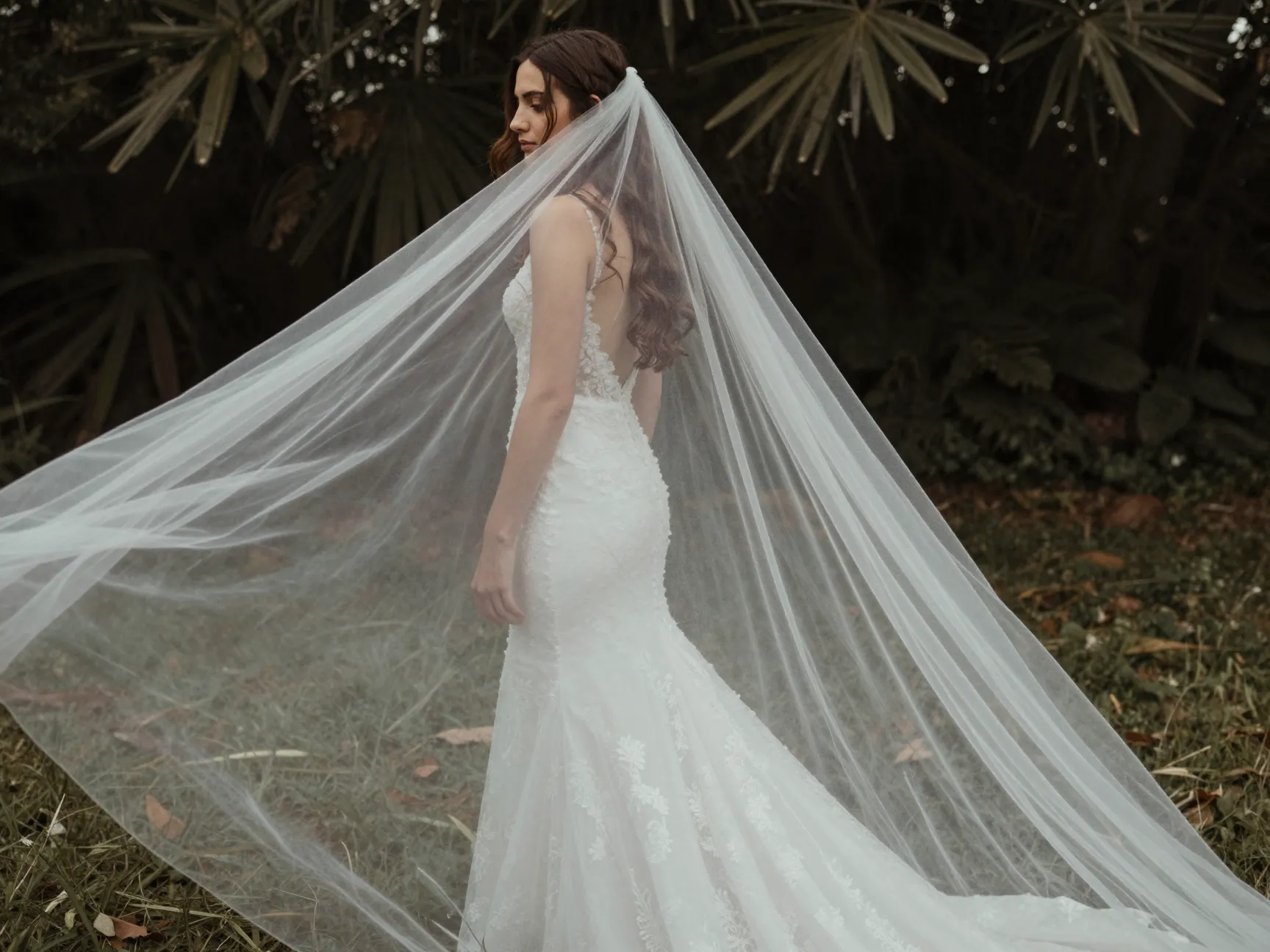 Loose boho waves with deep side part cathedral veil