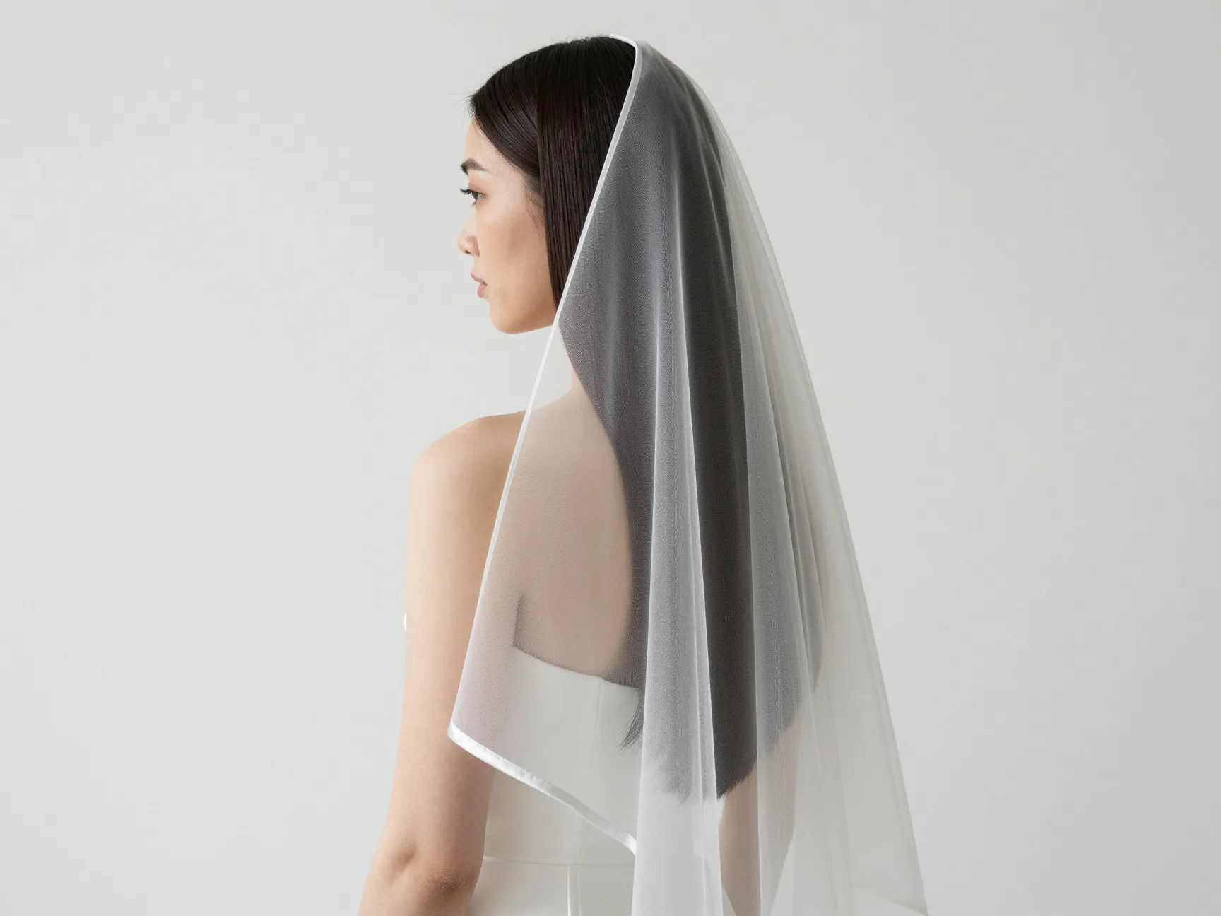 Sleek straight hair with minimalist silk edge veil