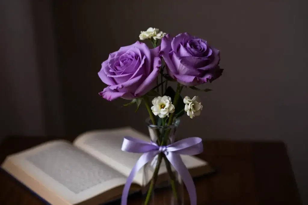 Two lavender roses delicate glass vase romantic mystery