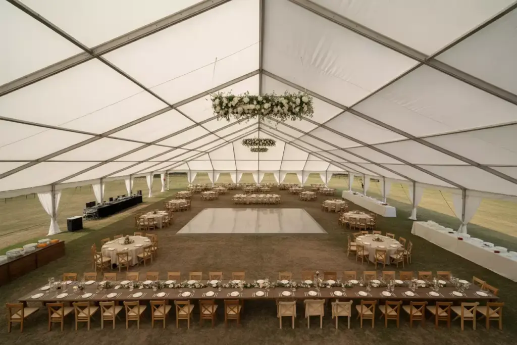 Spacious frame tent with pole free interior and dance floor for large reception