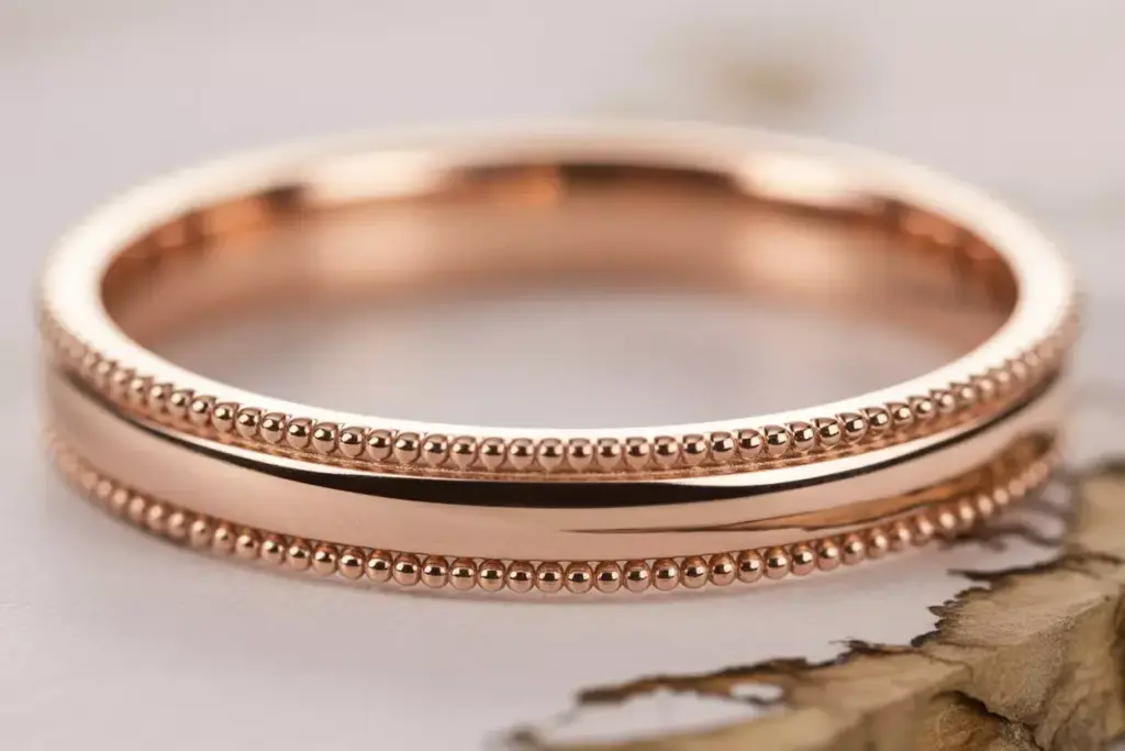Rose gold milgrain detail band close up macro shot