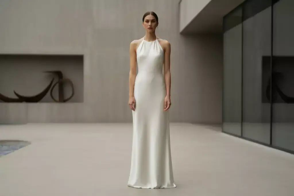 Minimalist column halter gown in modern venue