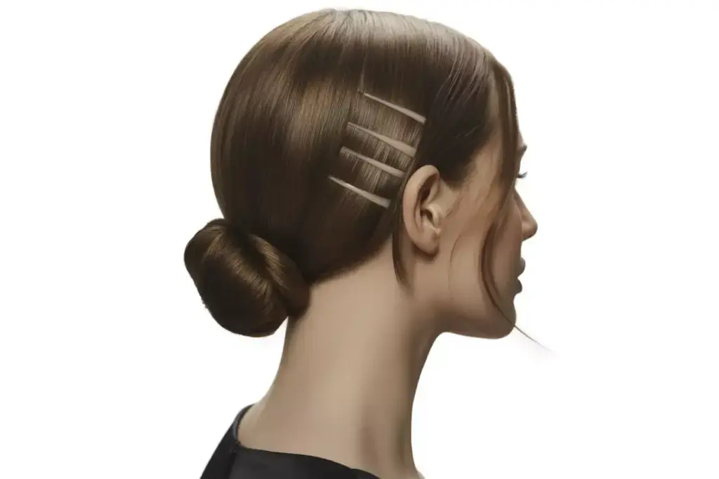 Sleek low chignon bob face framing wispy pieces