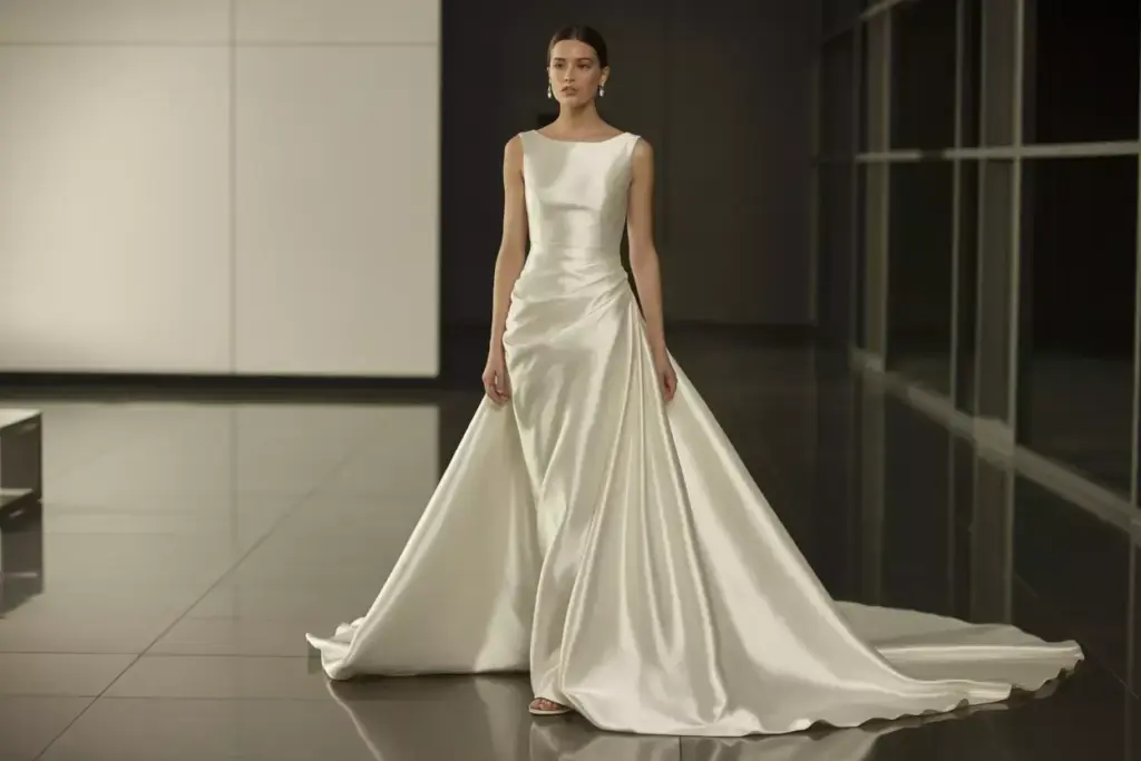 Satin wedding gown sleek column silhouette dramatic train