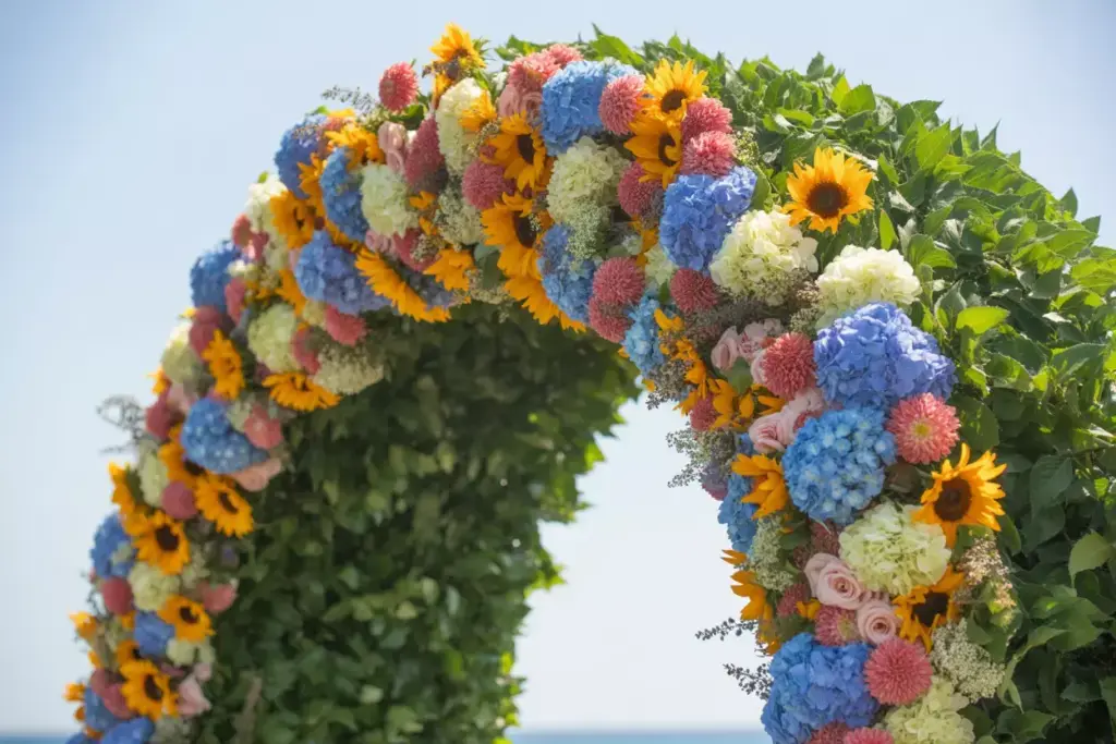 Summer seasonal floral arch with sunflowers hydrangeas