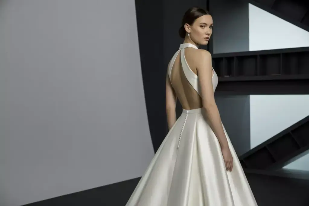 Modern mikado silk halter dress with geometric back cutouts