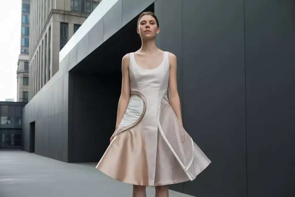 Contemporary mixed texture scoop neck dress architectural details