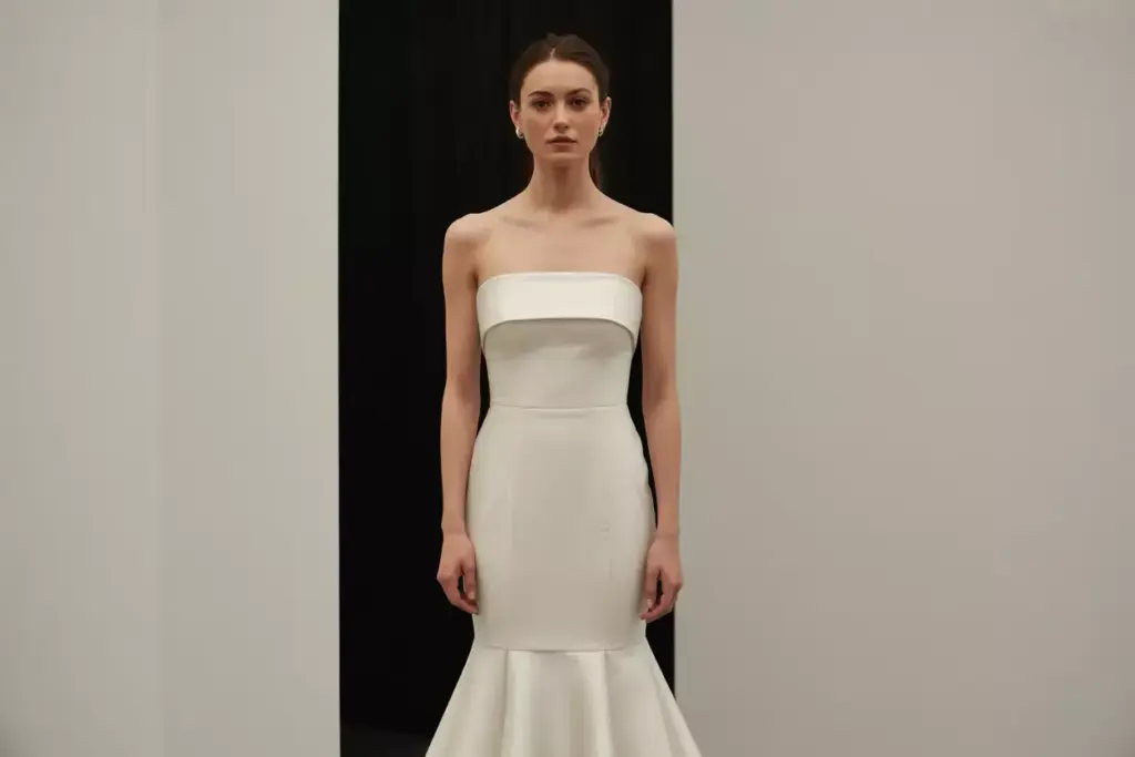 Modern strapless mermaid gown with straight across neckline in crepe