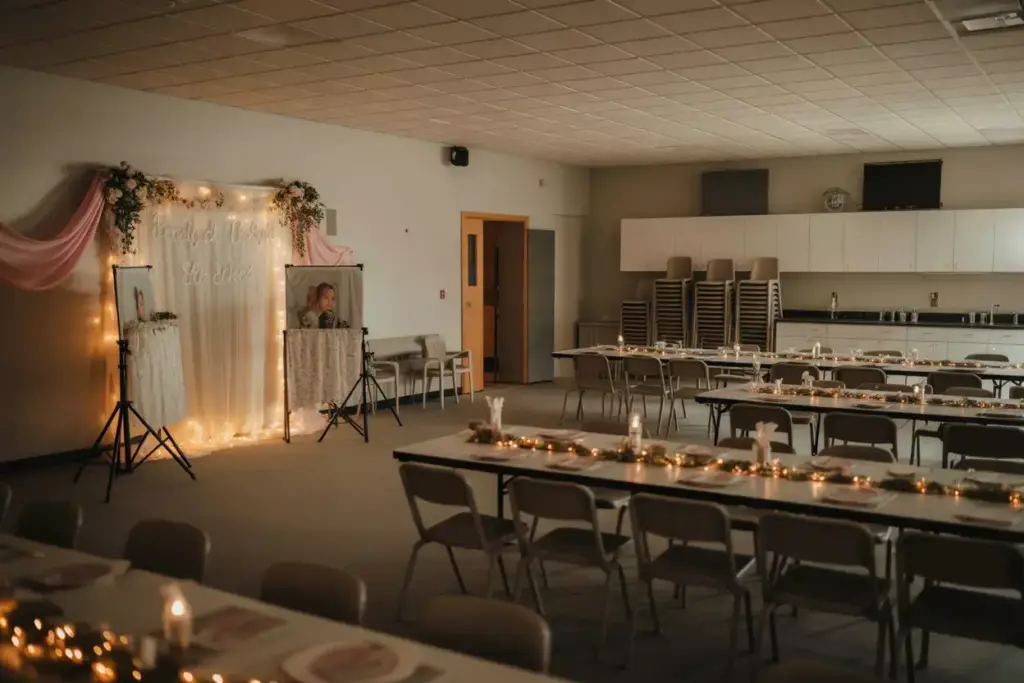 Community hall bridal shower decorated with fabric and lights