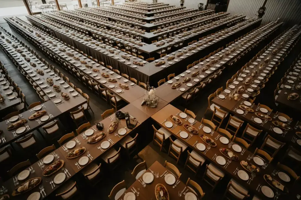 Herringbone pattern long banquet tables rustic wedding reception