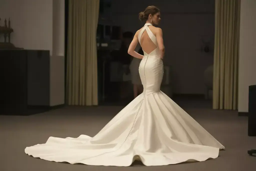 The sculpting mermaid halter with dramatic train in motion