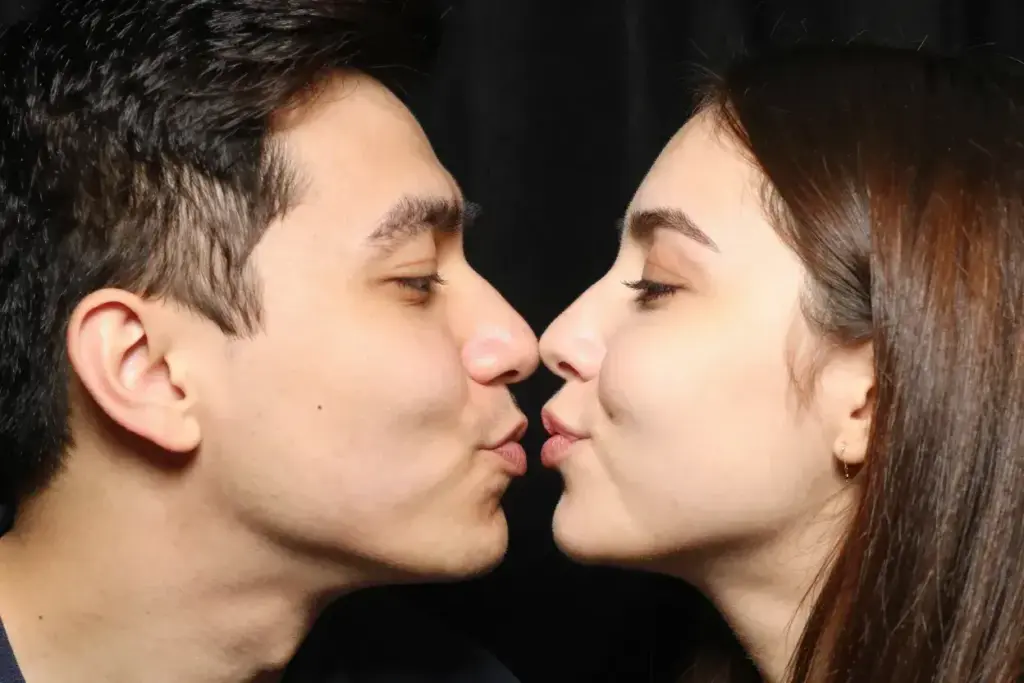 The nose to nose nuzzle playful couple eskimo kiss