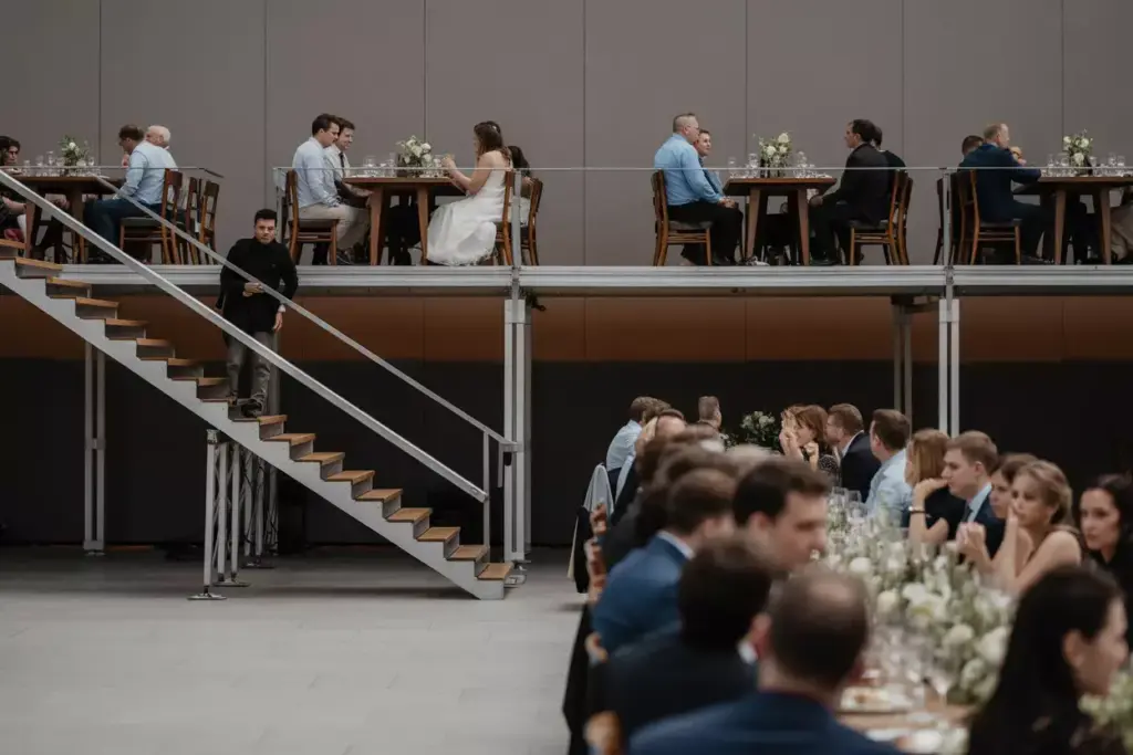 Tiered reception seating platforms elevated dining tables